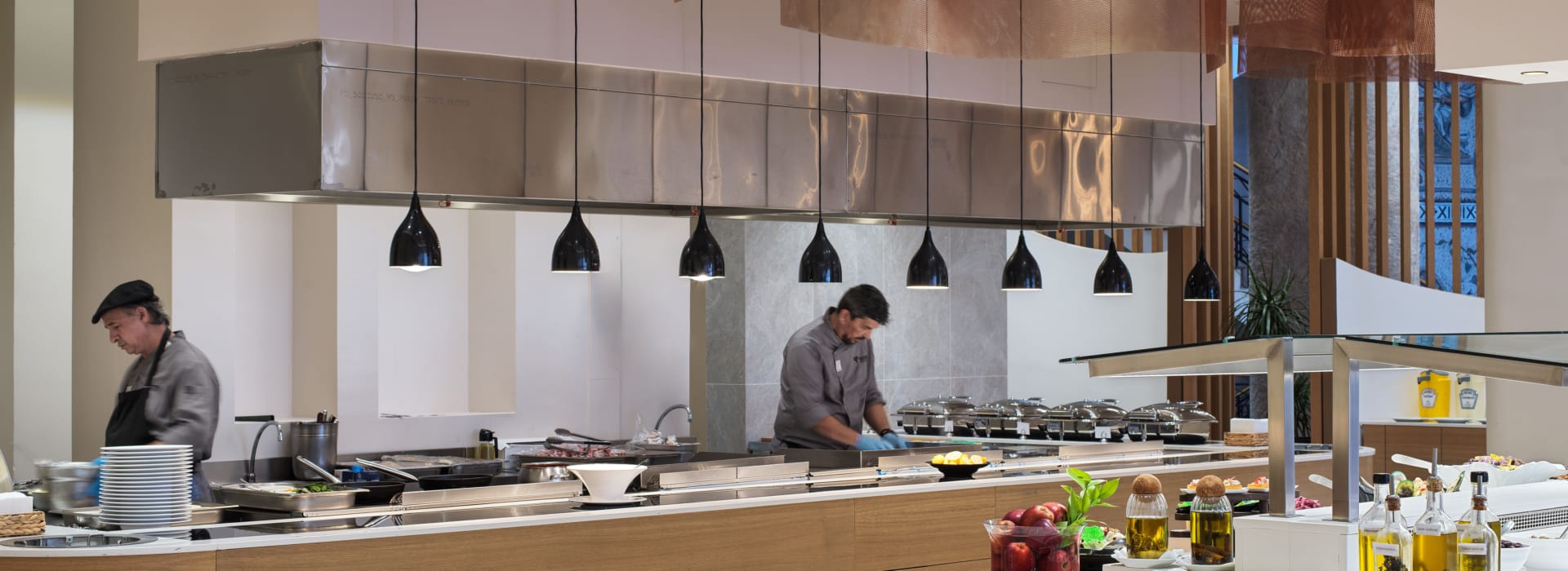 a group of people cooking in a restaurant