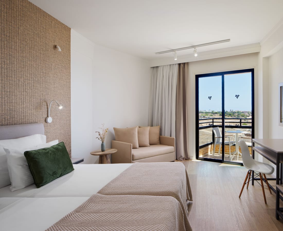a room with a bed and a desk