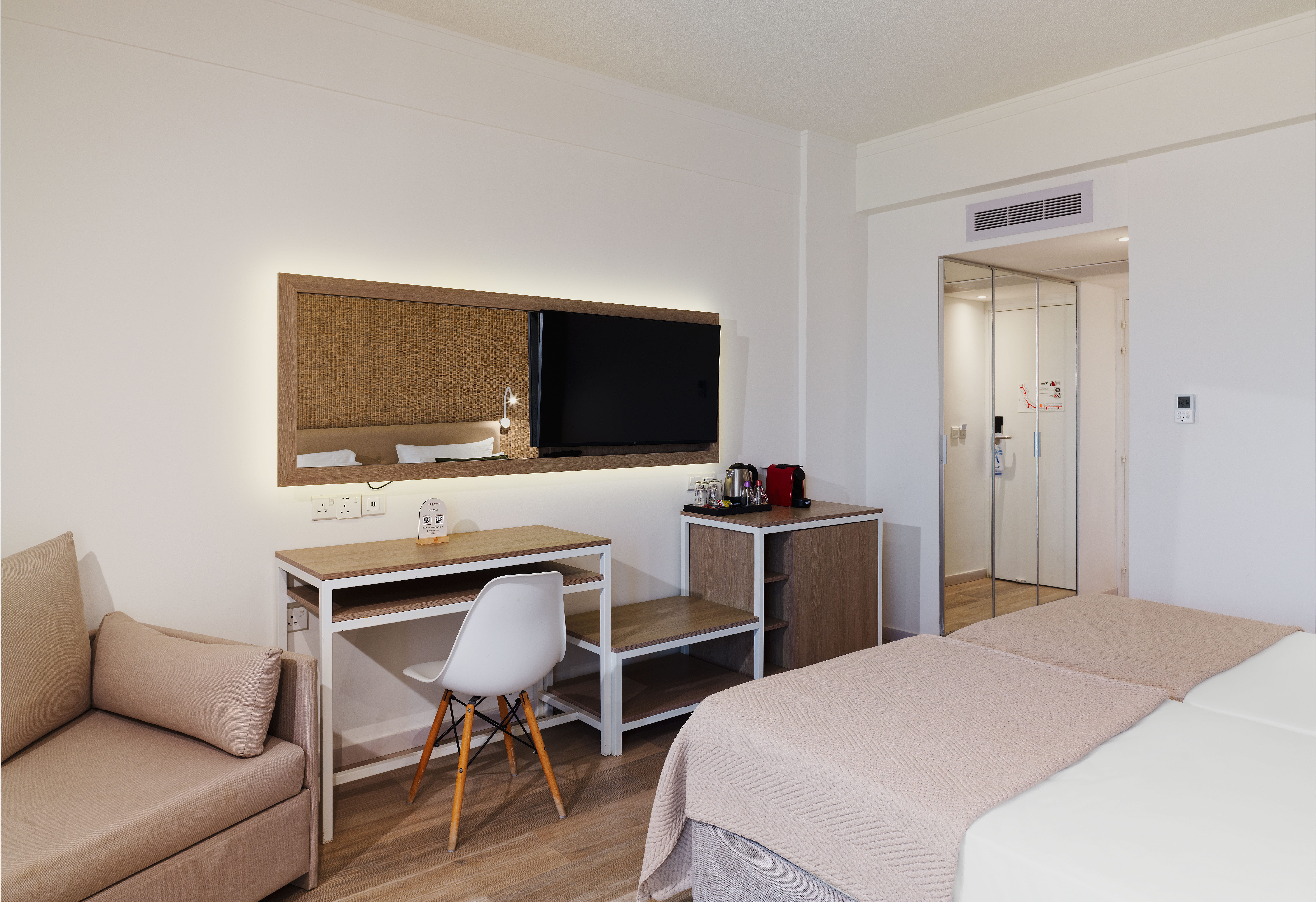 a room with a bed and a tv