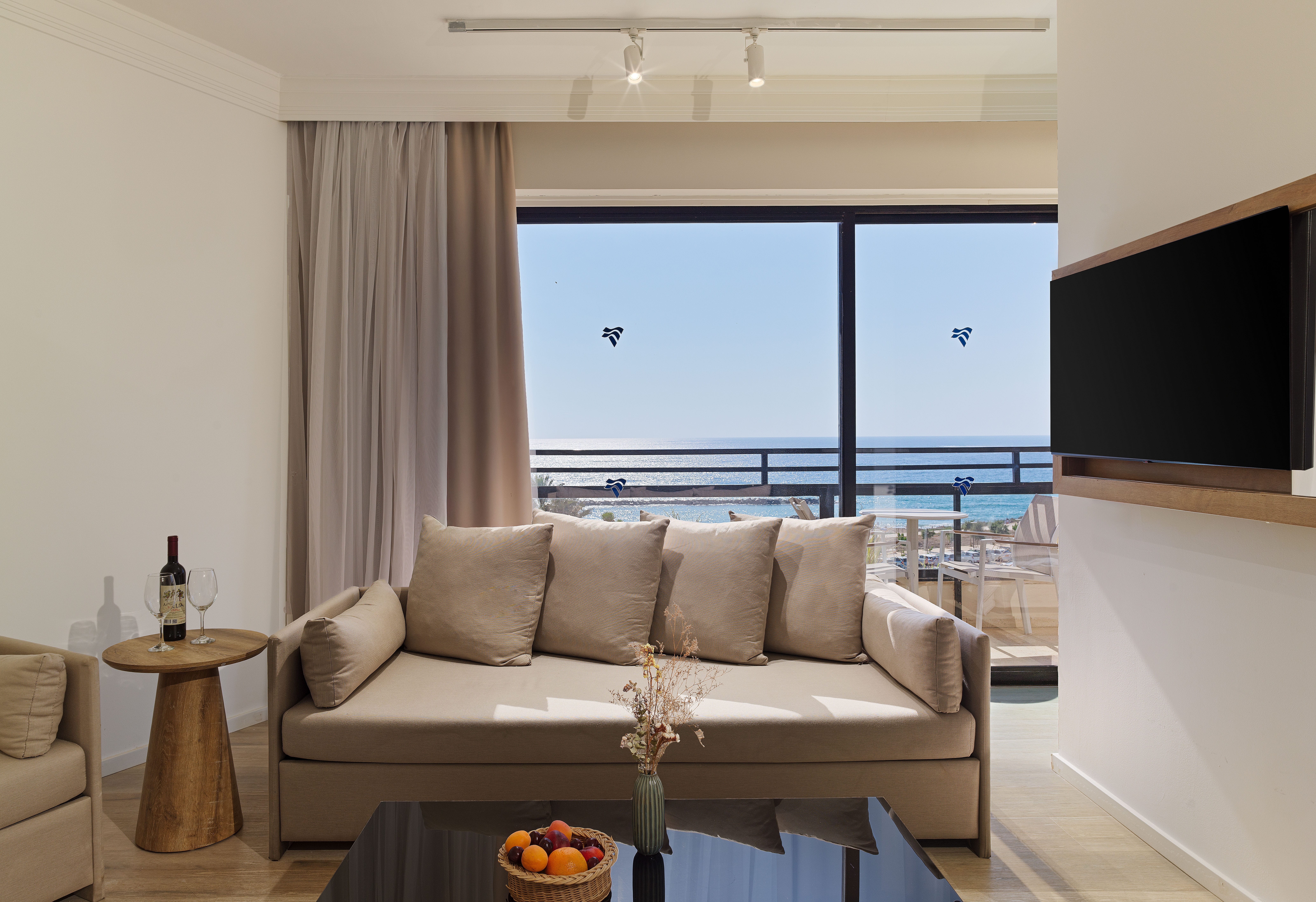 a living room with a couch and a television