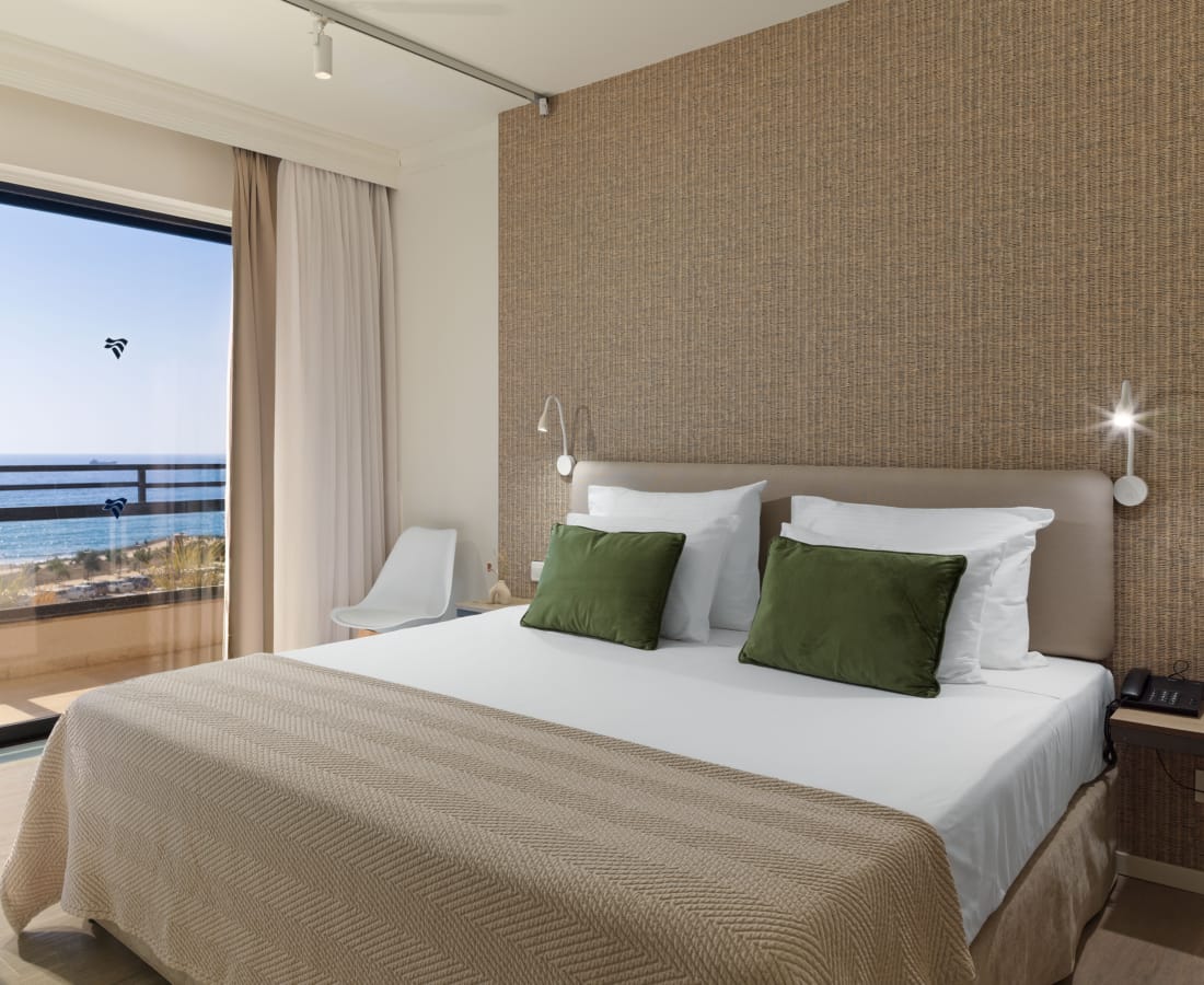 a bedroom with a bed and a tv
