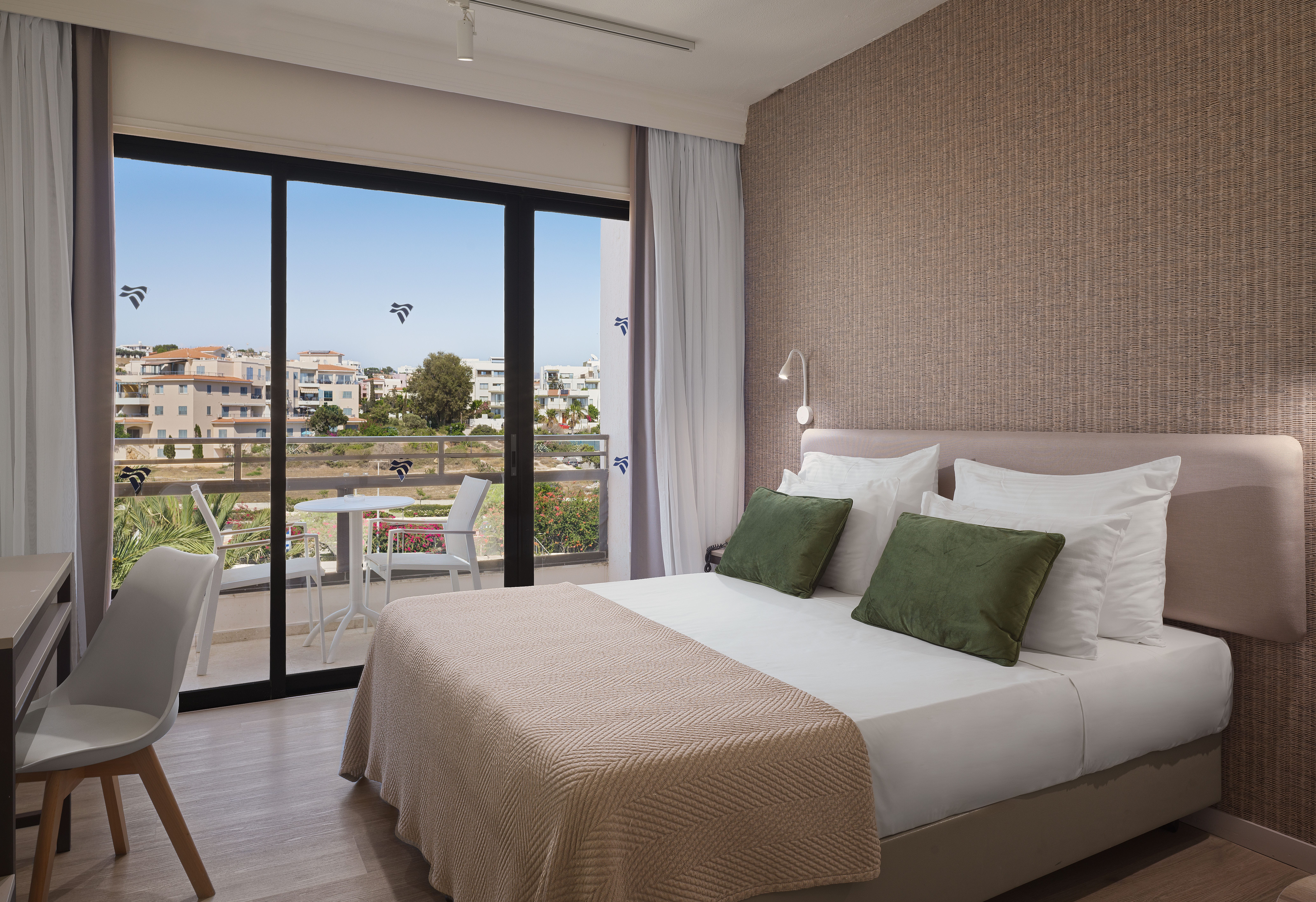 a bedroom with a large window