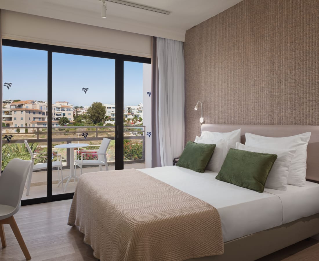 a bedroom with a large window