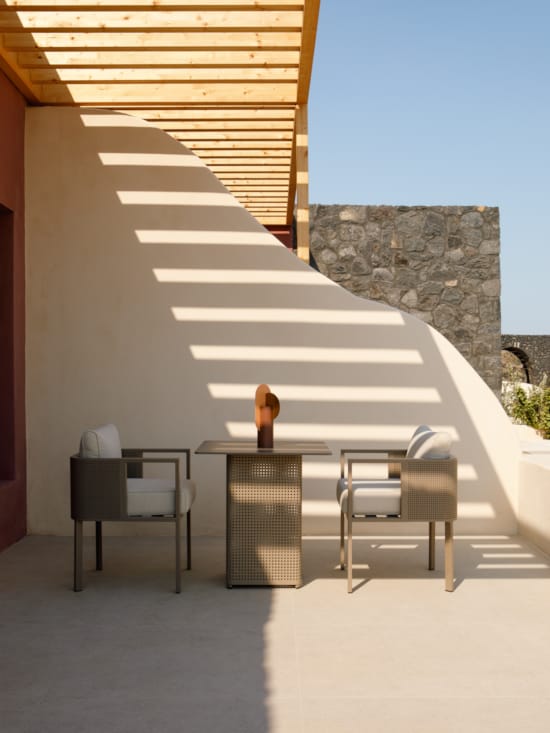 a table and chairs outside a building