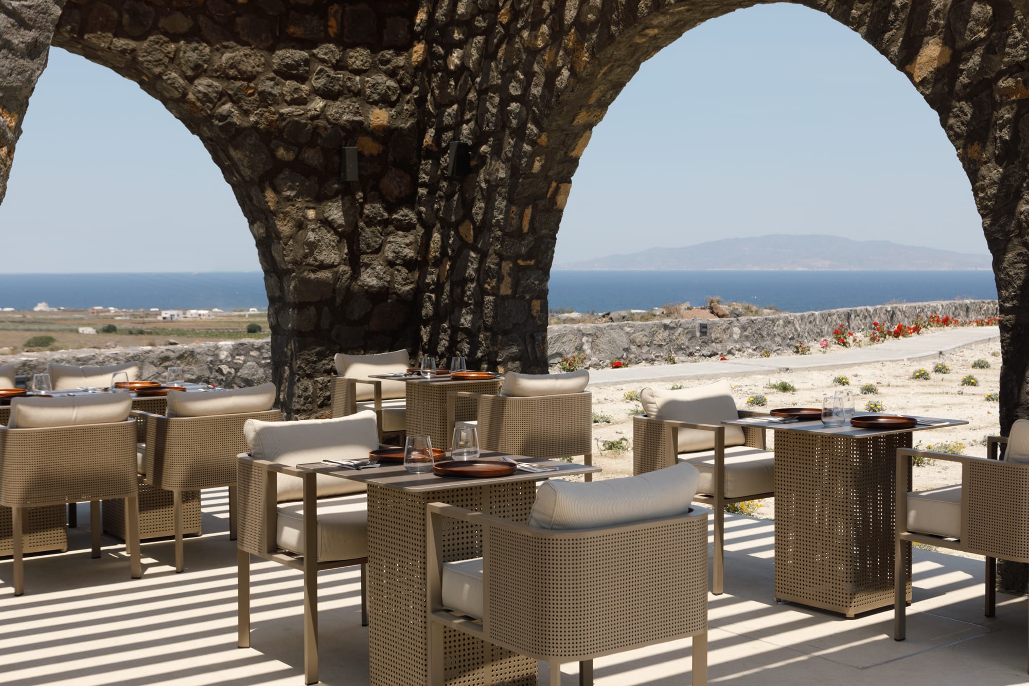 a patio with tables and chairs