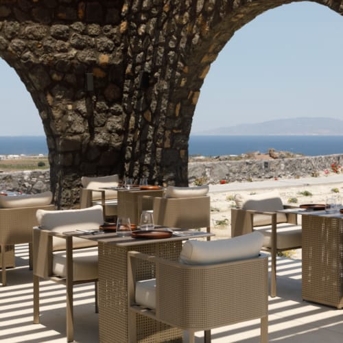 a patio with tables and chairs