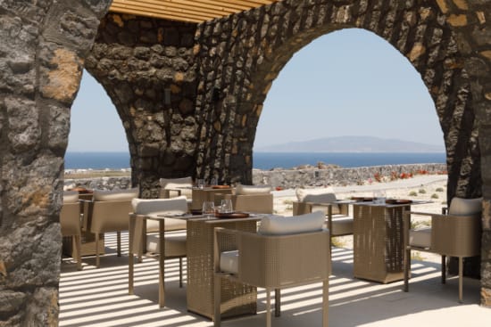 a patio with tables and chairs