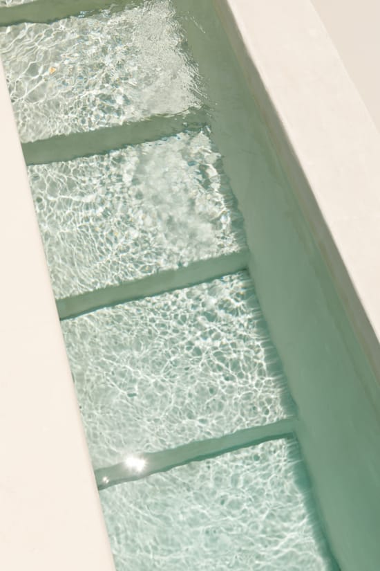 a green and white tiled floor