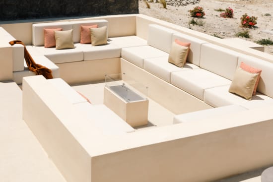 a white couch with pillows