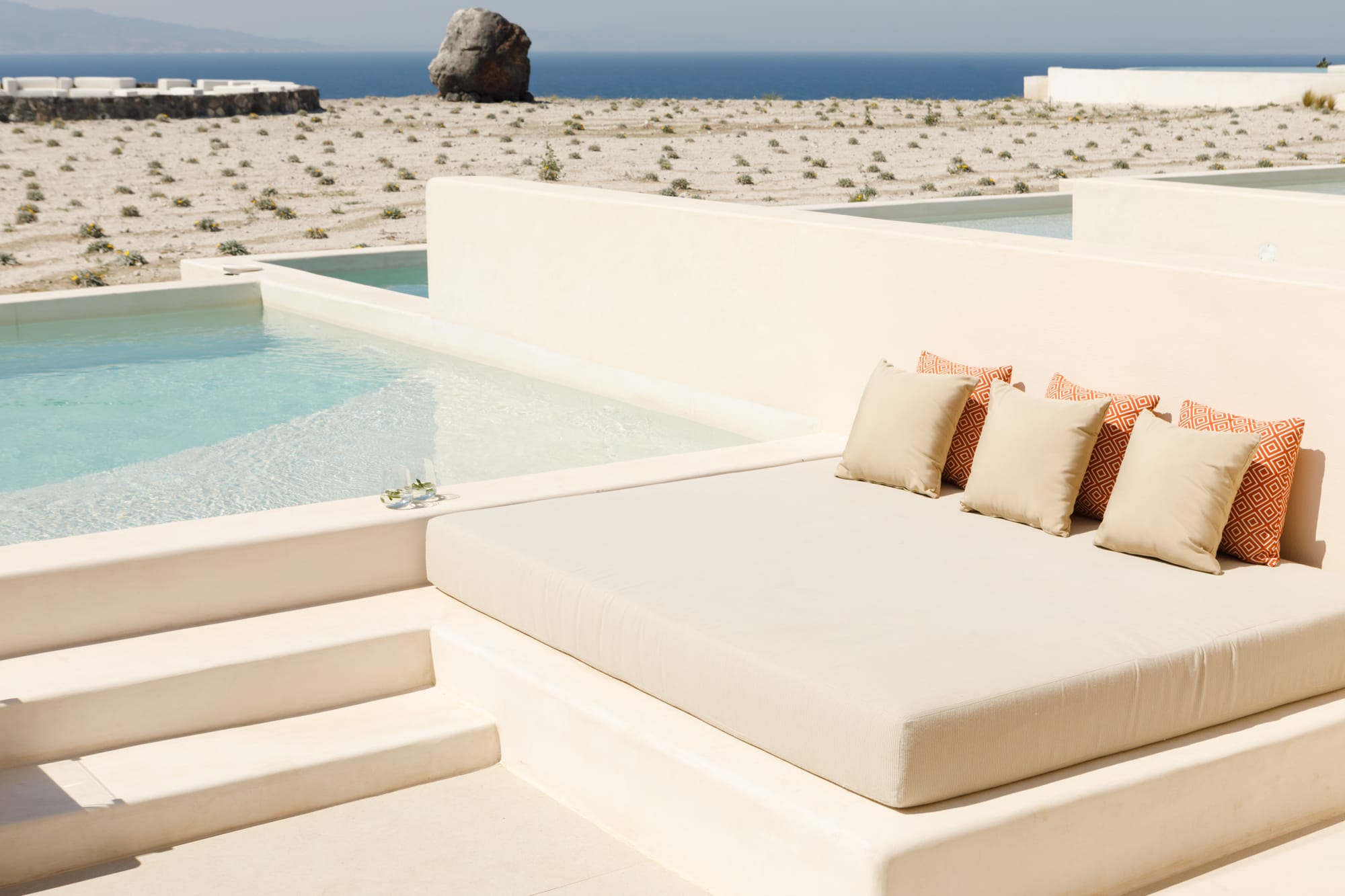a white couch on a beach