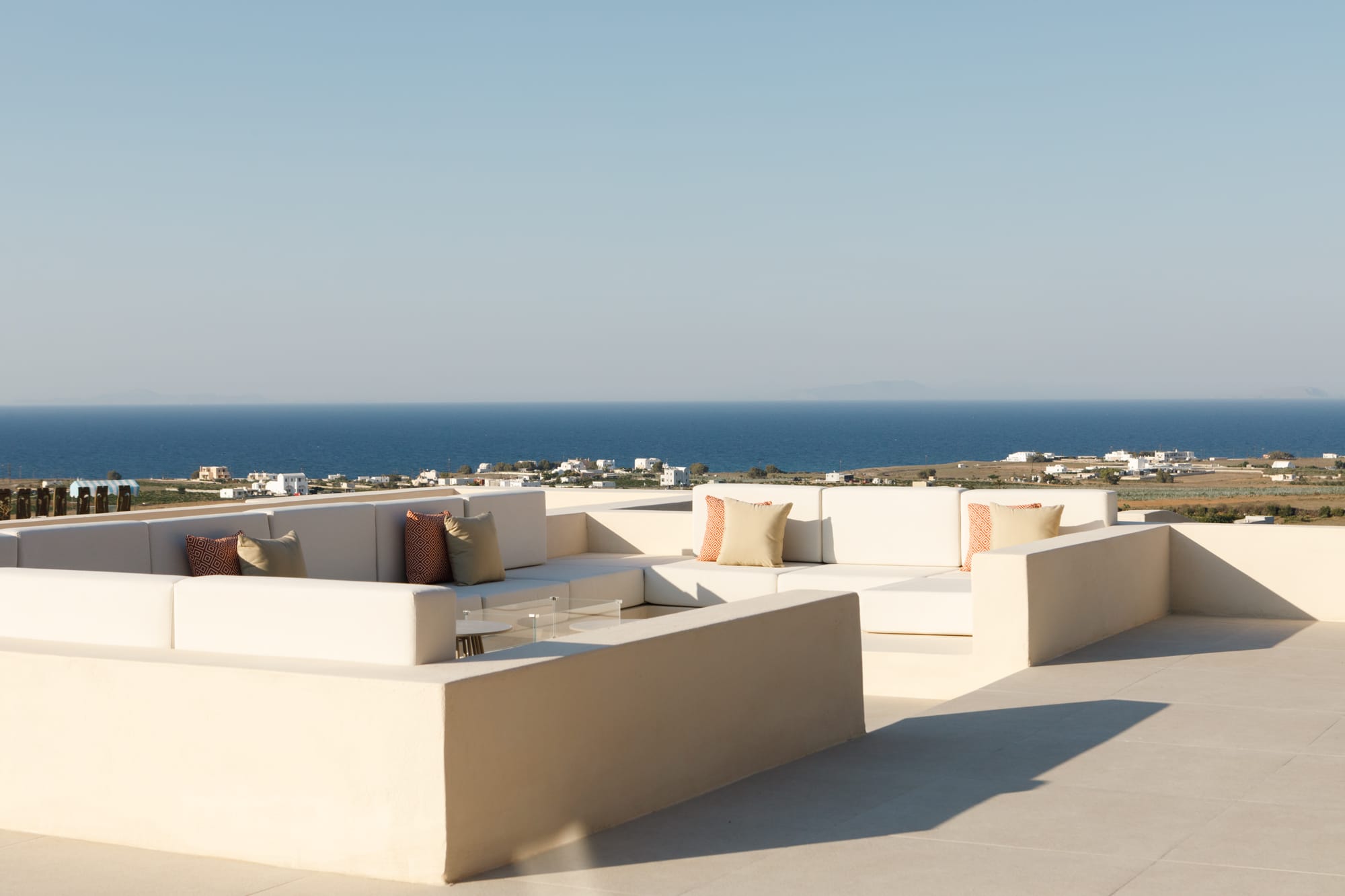 a large group of white cubes on a beach