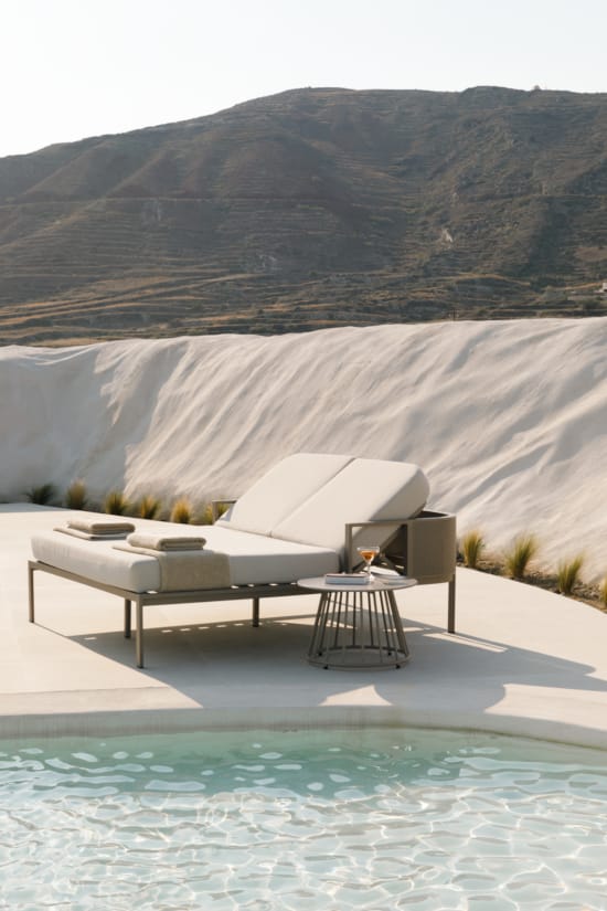 a white building with a pool in front of it