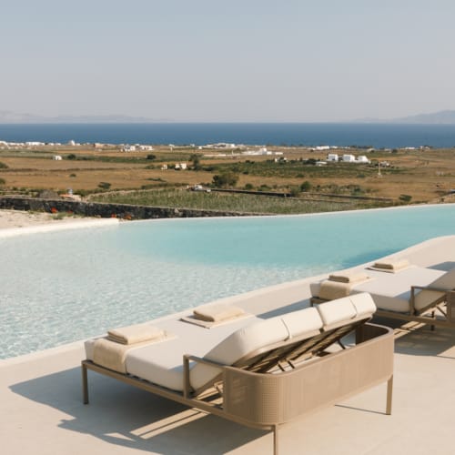 a pool with a lounge chair