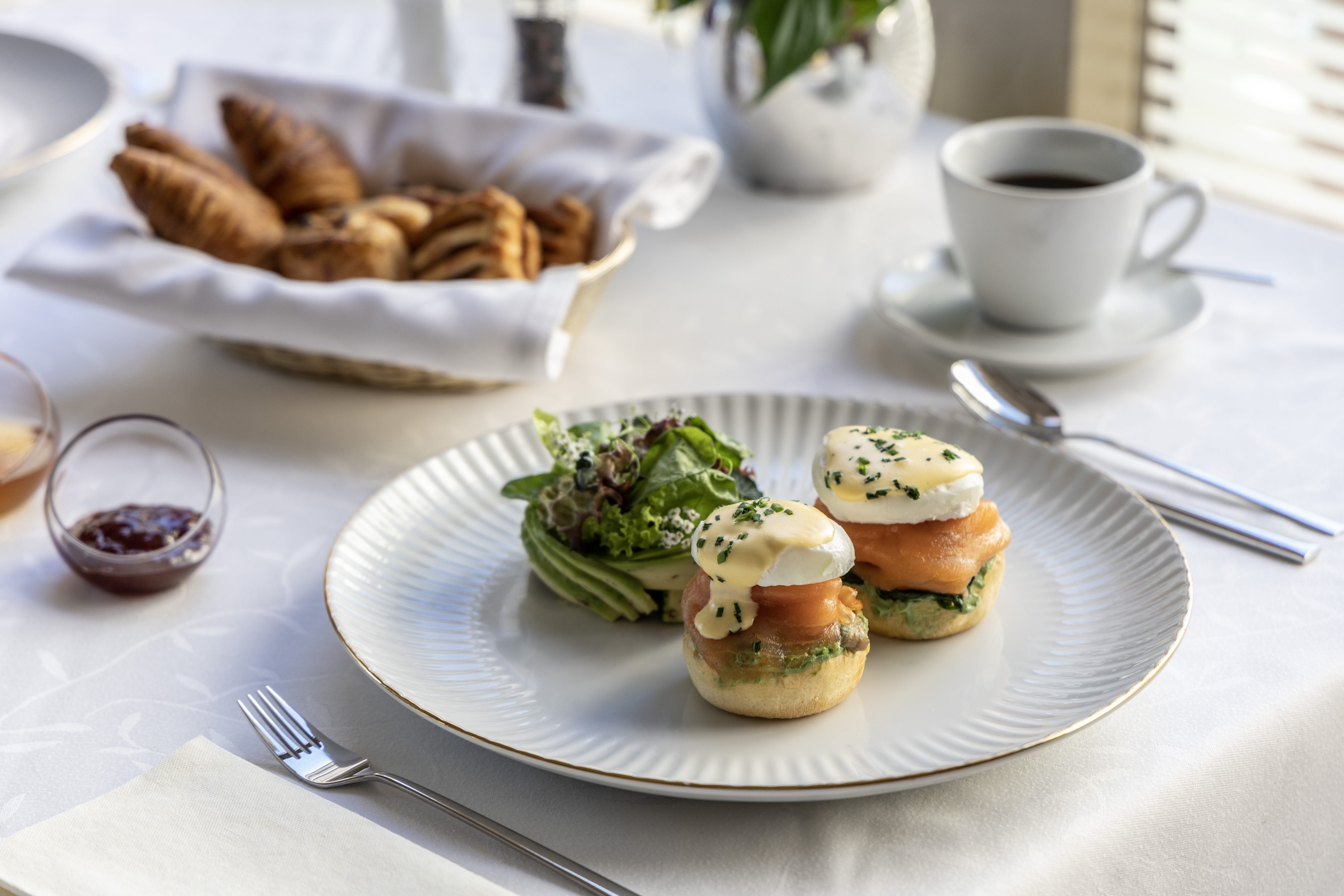 a plate of food and a cup of coffee