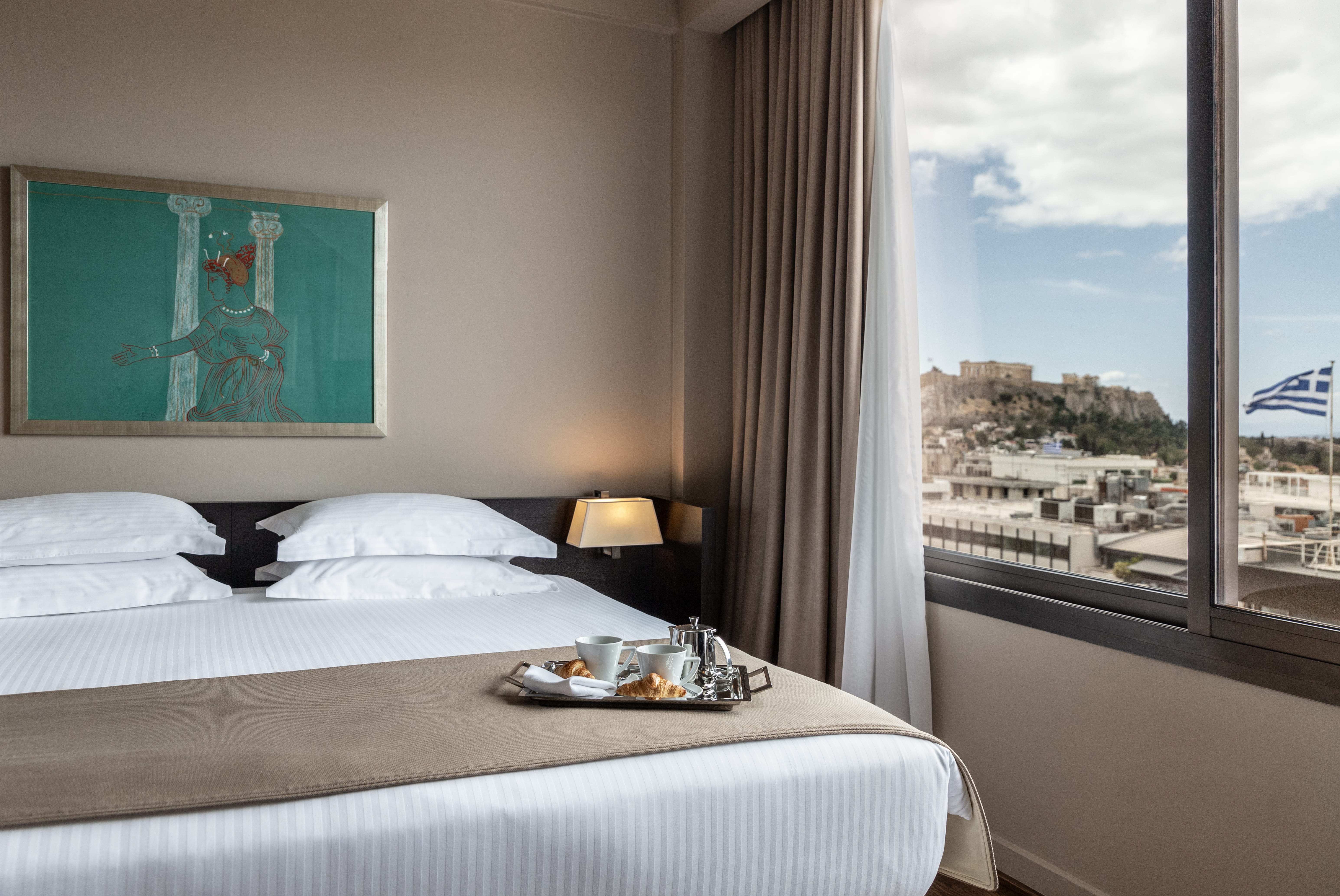 a bedroom with a large window