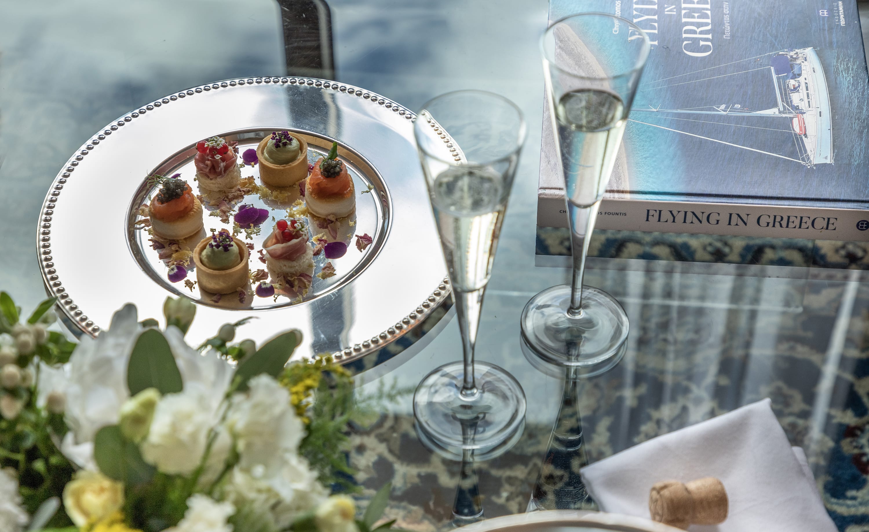 a plate of desserts and glasses
