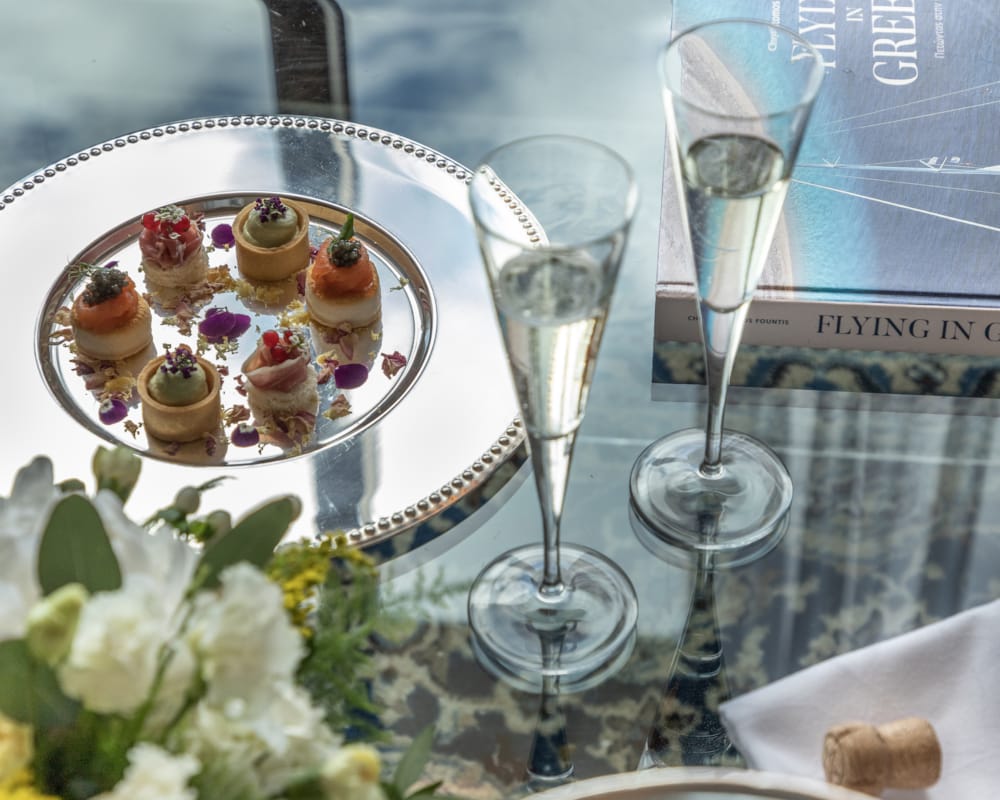 a plate of desserts and glasses