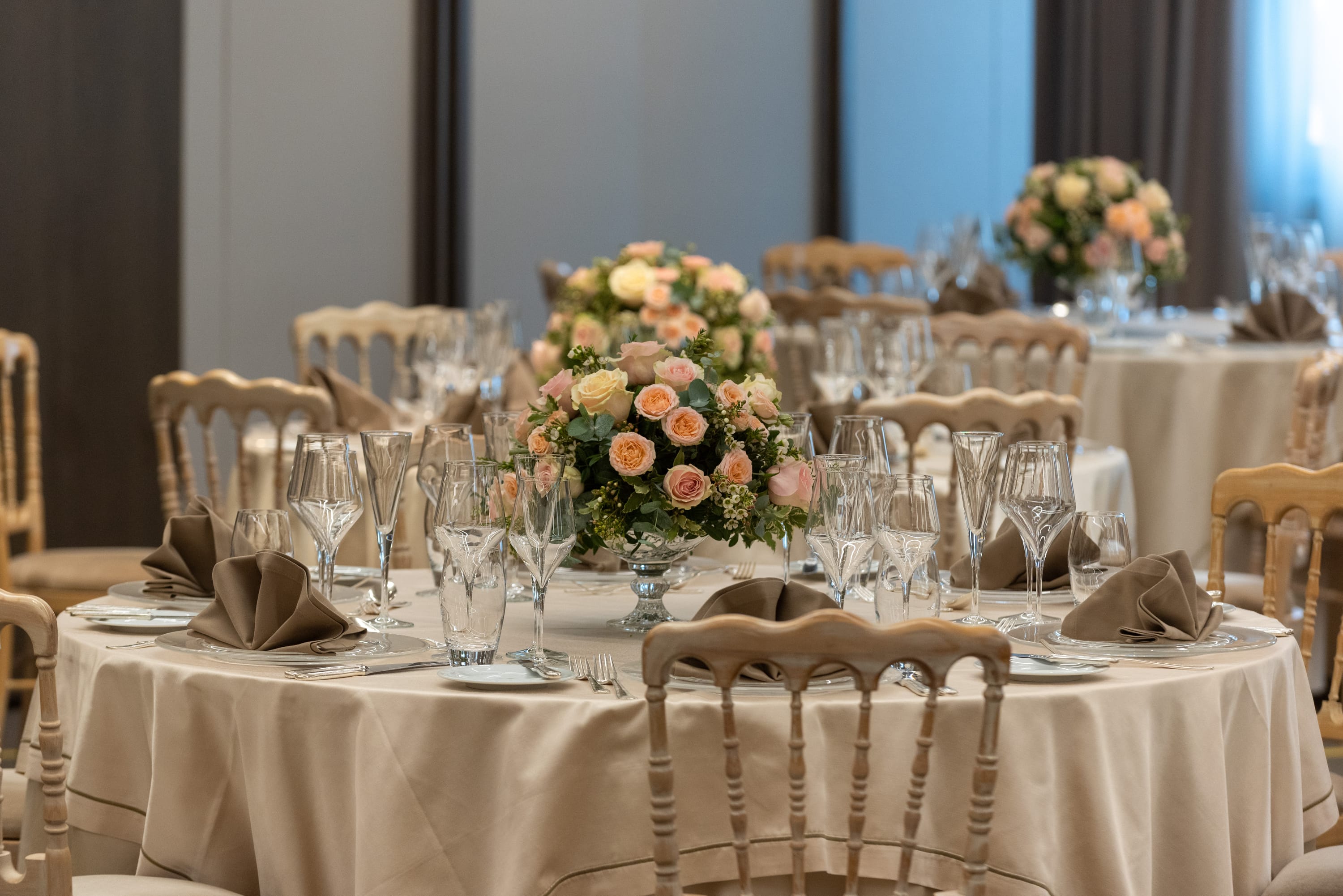 a table set with chairs and flowers