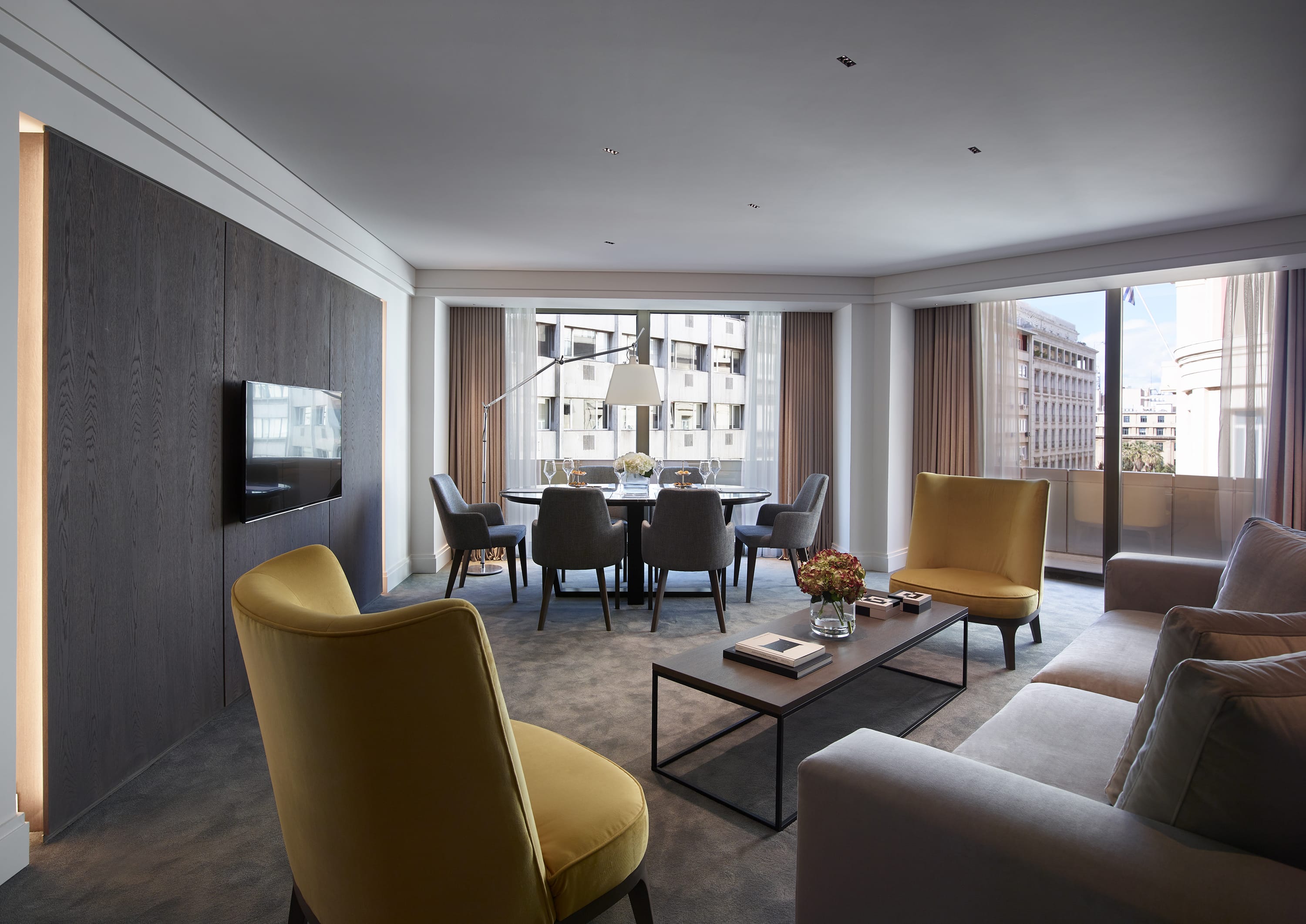 a living room with a tv and couches