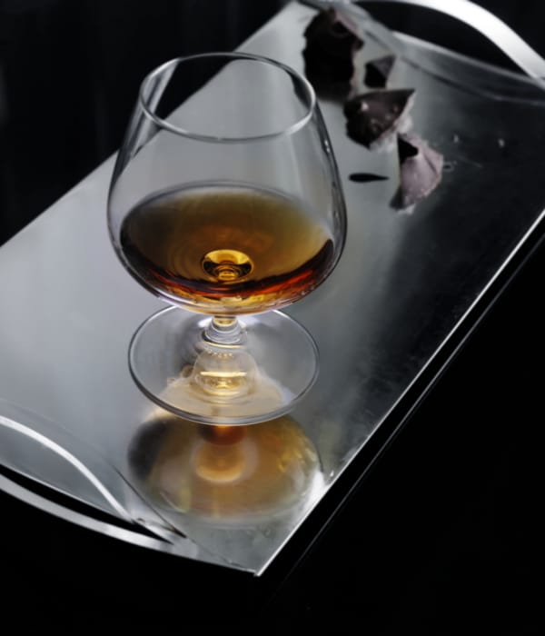 a glass of liquid on a table