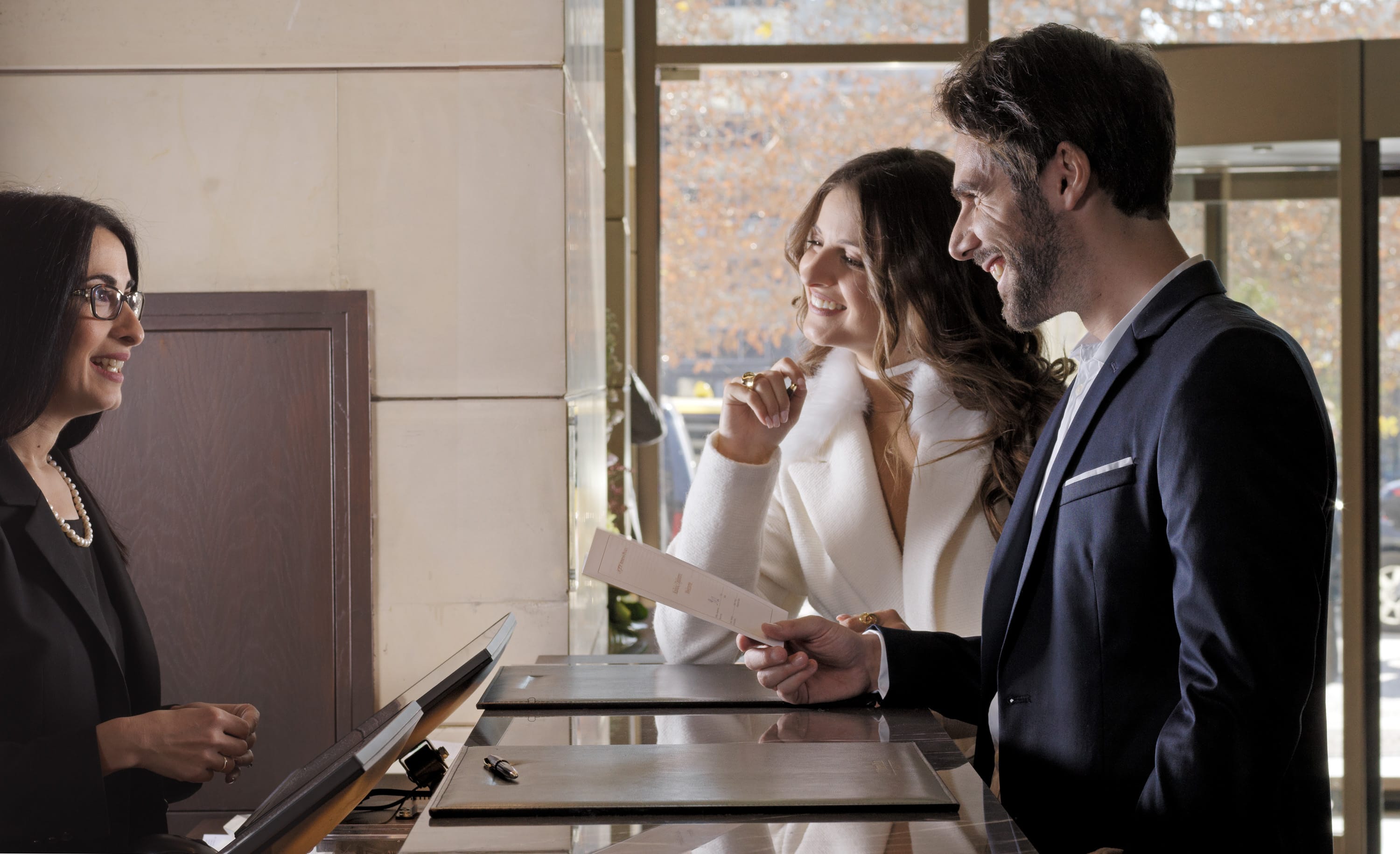 a group of people looking at a paper