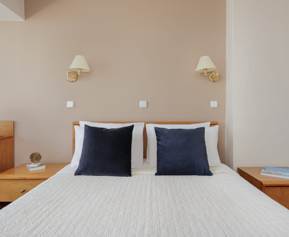 a building with a body of water in the background