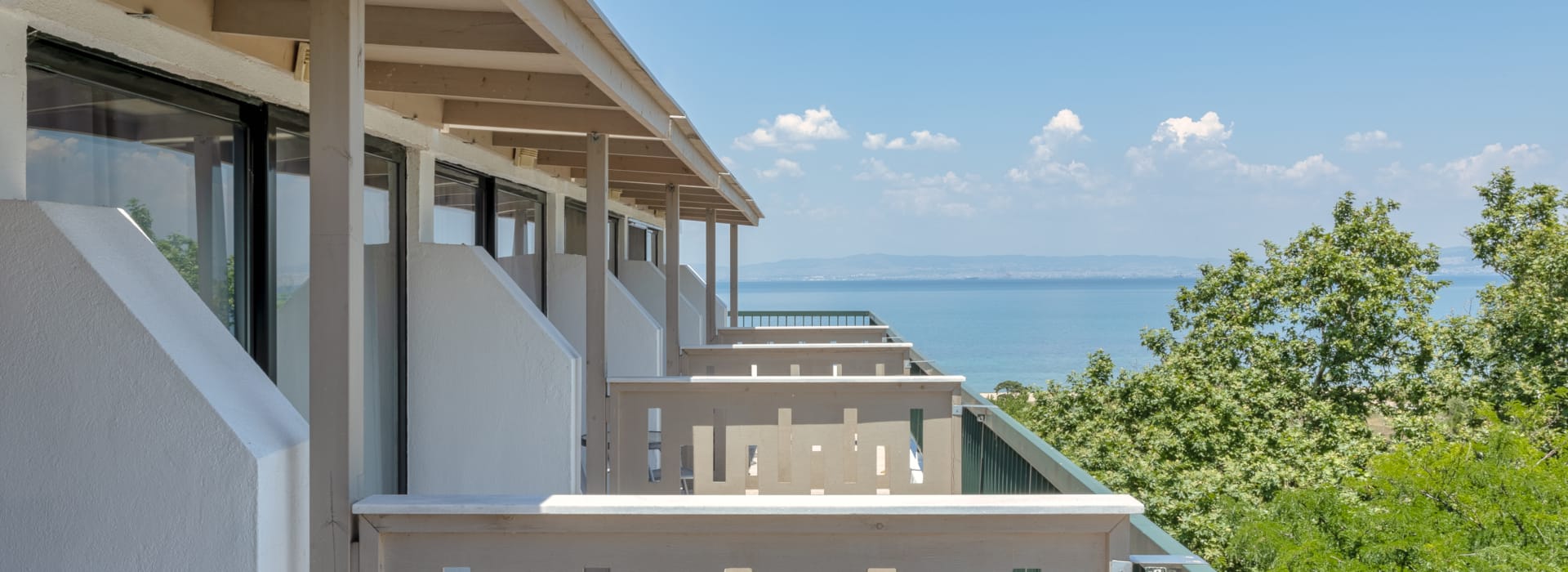 a building with a body of water in the background