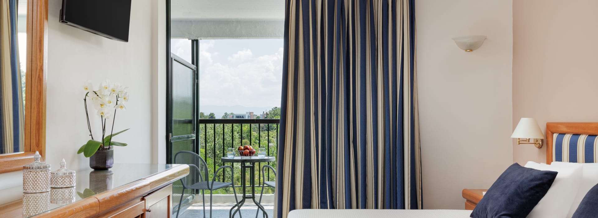 a bedroom with a large window