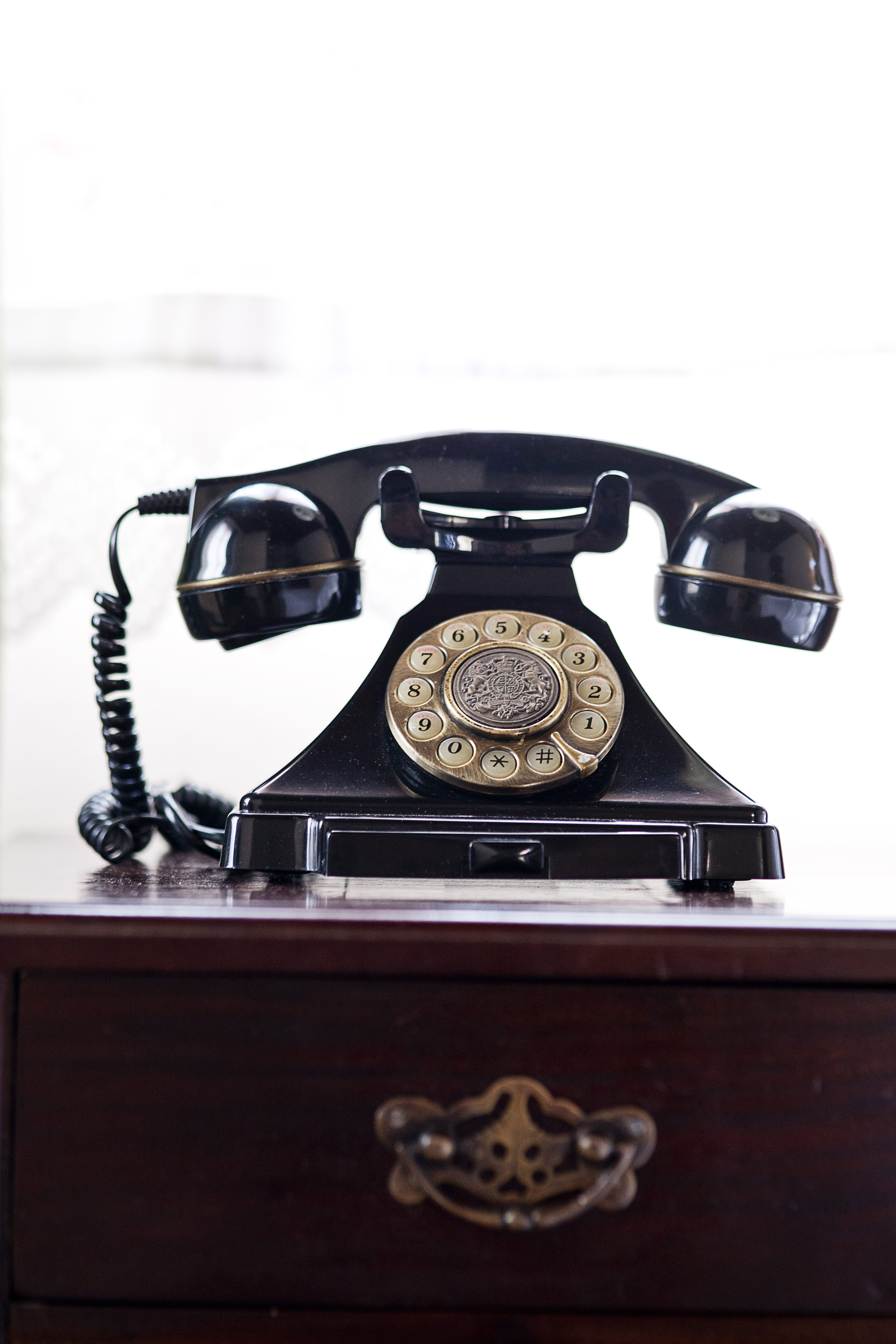 a telephone on top of a dresser