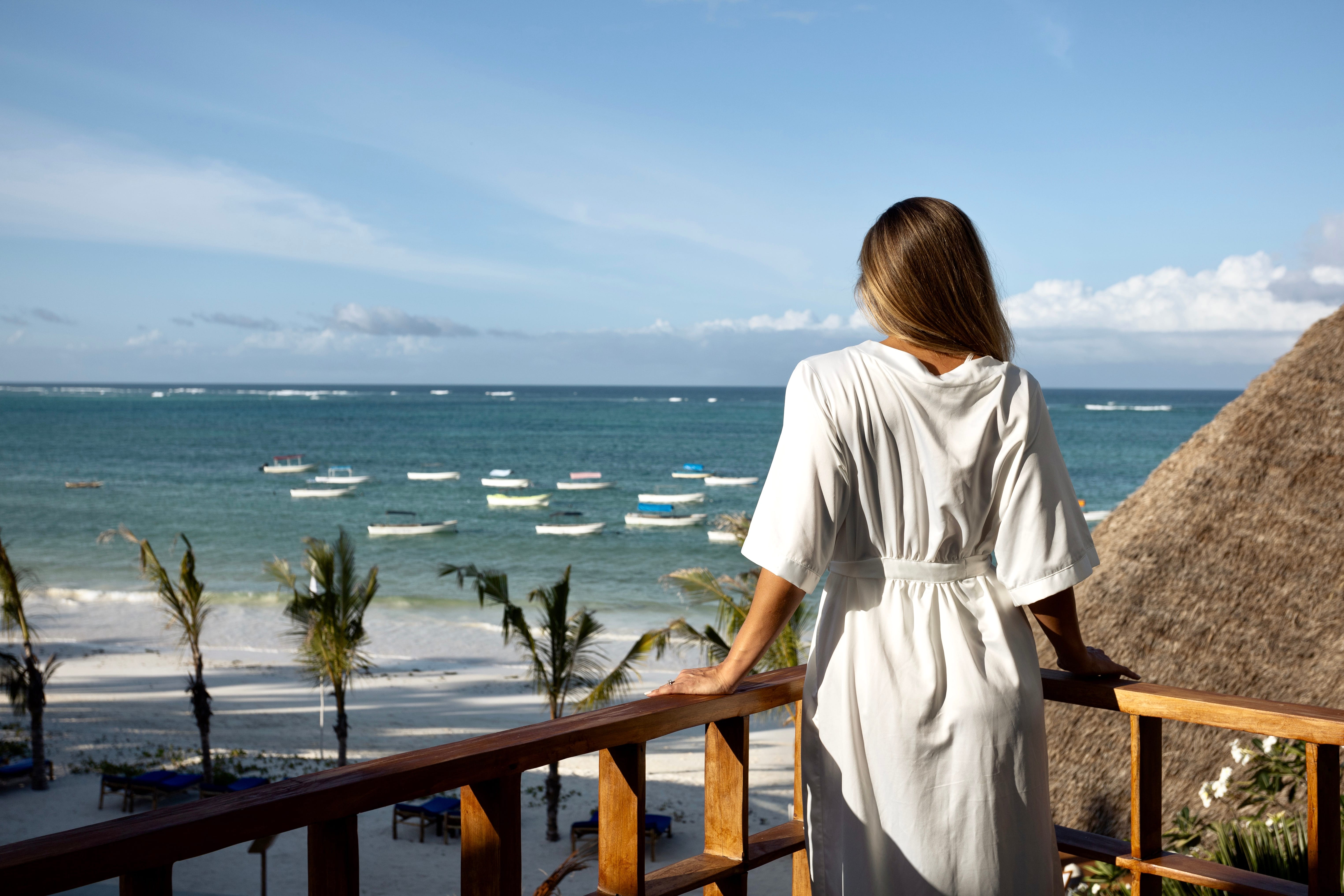 a person looking out over the ocean
