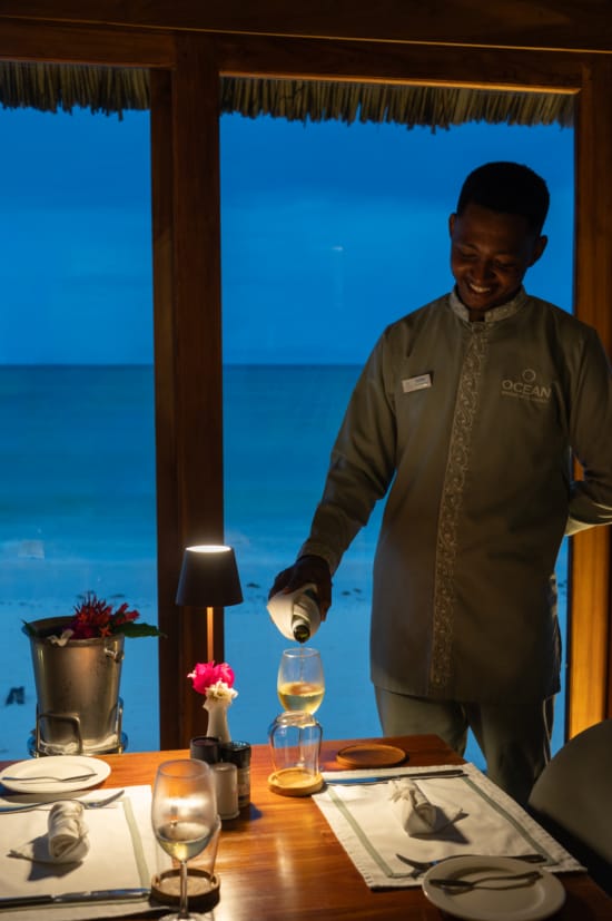 a person standing next to a table