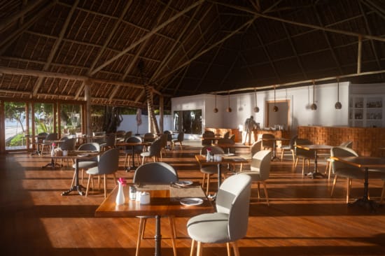 a room with tables and chairs