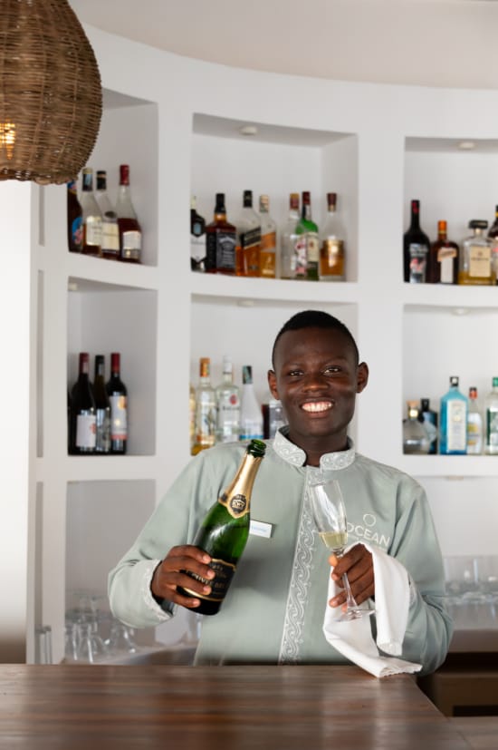 a person holding a bottle of wine