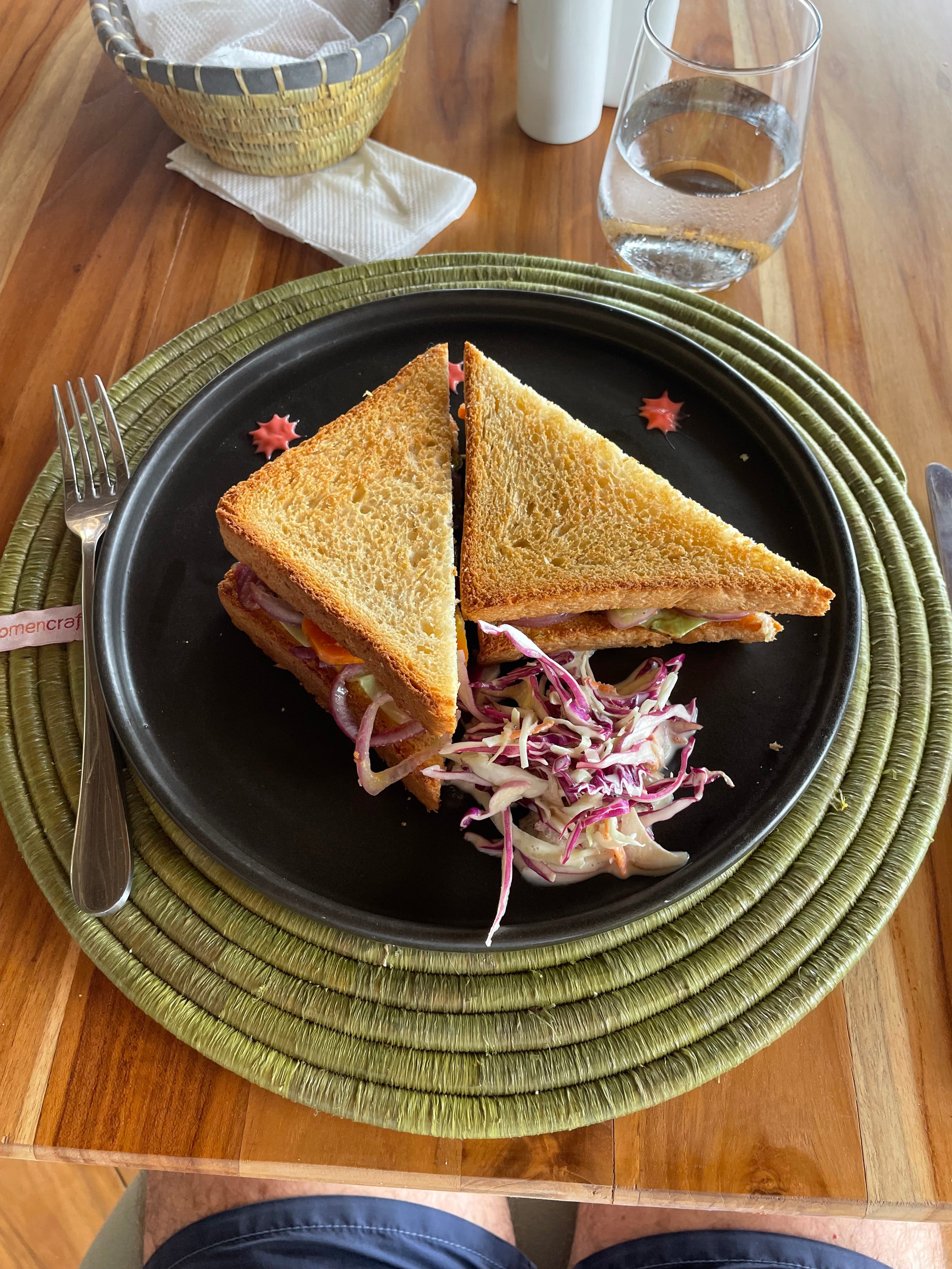 a sandwich with a side of salad