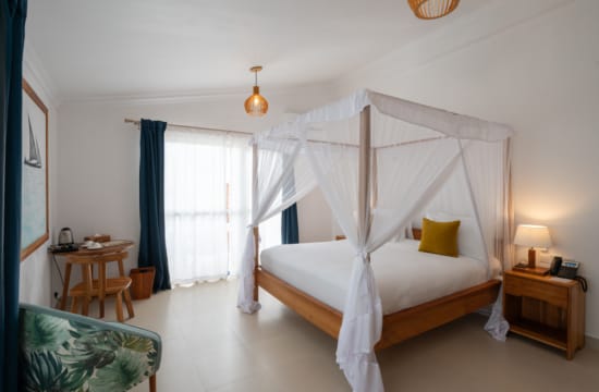 a bed with a white canopy