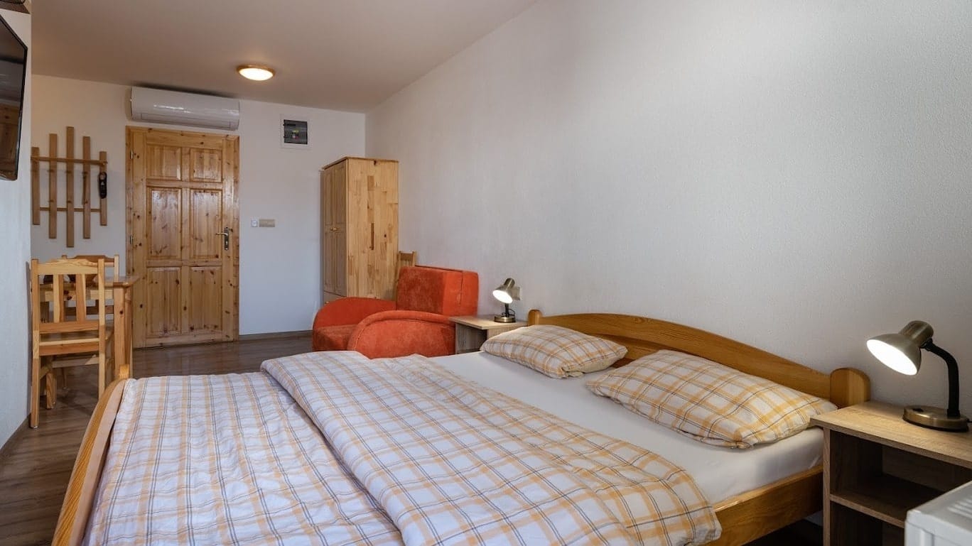 a bedroom with a bed and a chair