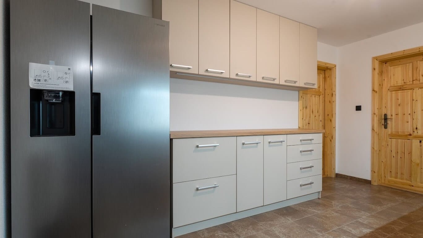 a kitchen with white cabinets