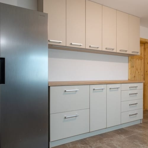 a kitchen with white cabinets