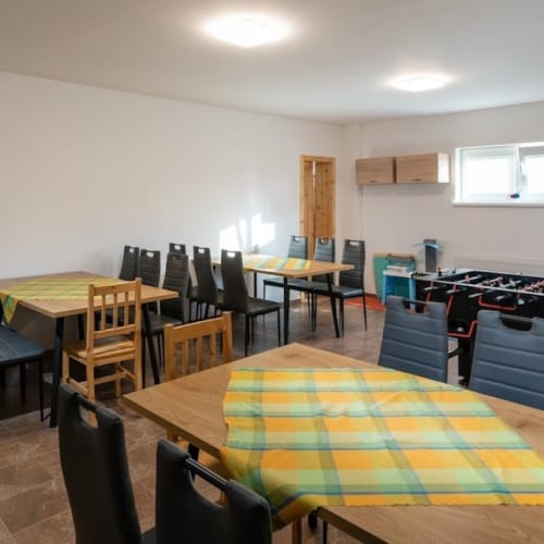 a room with tables and chairs
