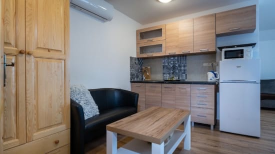 a kitchen with wooden cabinets