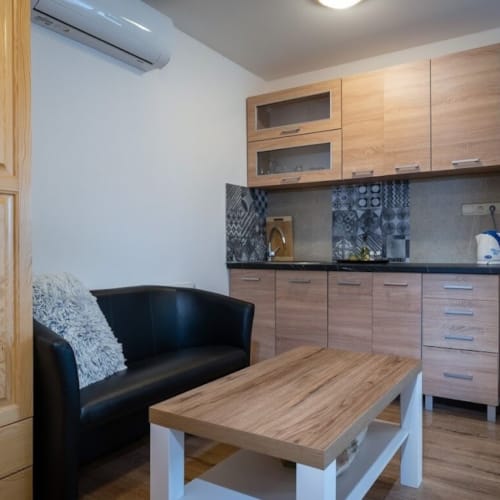 a kitchen with a table and chairs