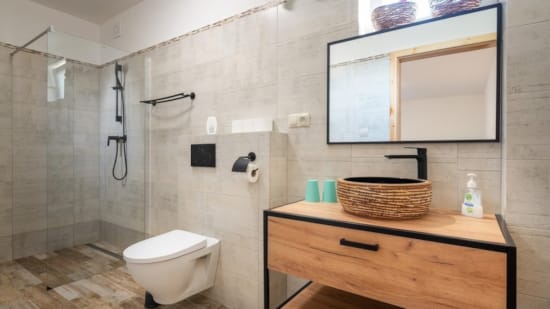 a bathroom with a tub and toilet