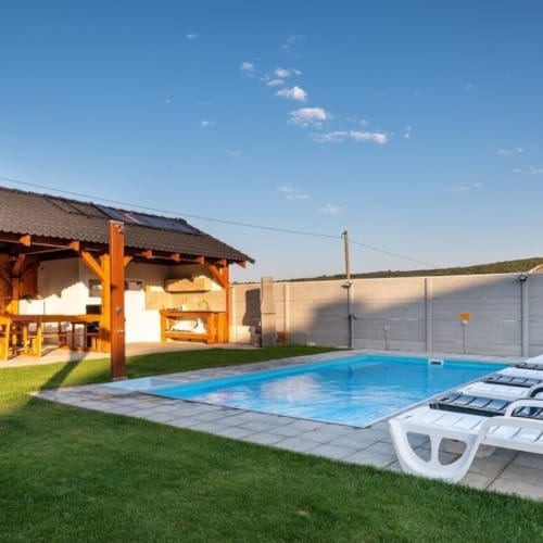 a swimming pool next to a house