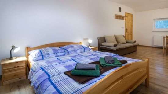 a bed with a blue blanket