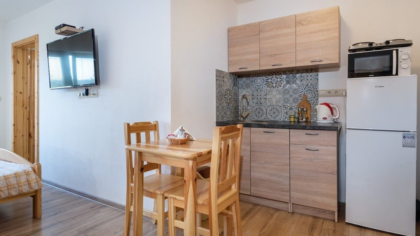 a kitchen with a table and chairs