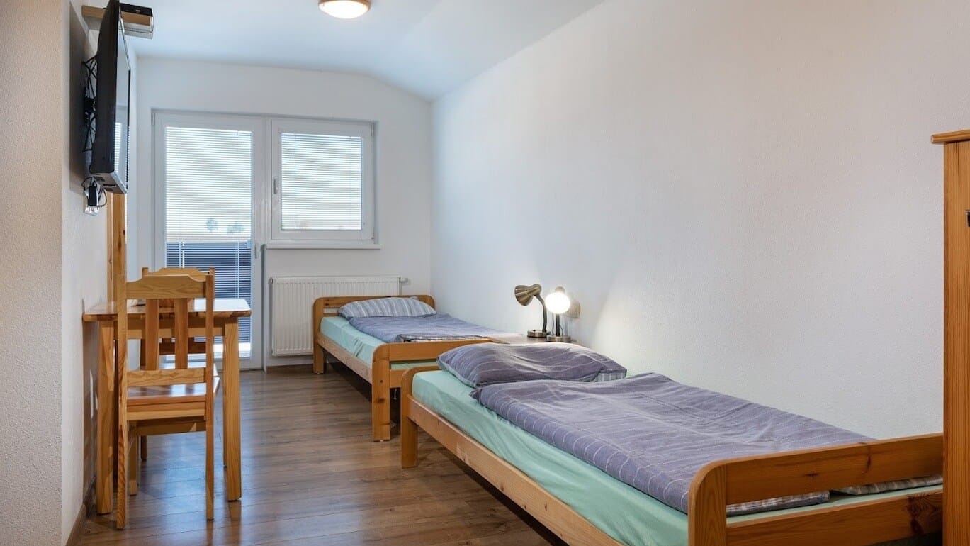 a bedroom with two beds