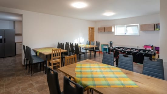 a room with tables and chairs