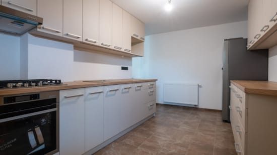 a kitchen with white cabinets