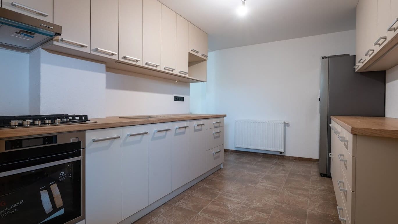 a kitchen with white cabinets