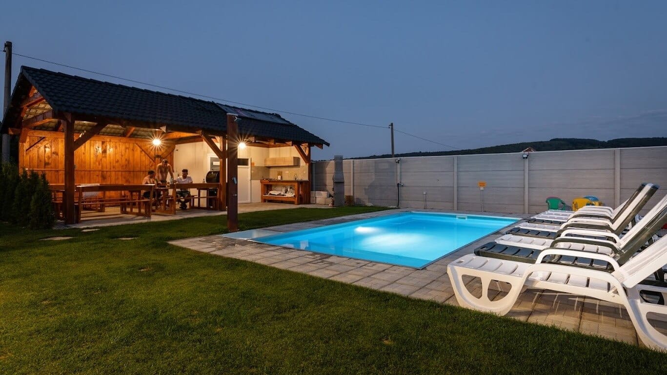a swimming pool next to a house